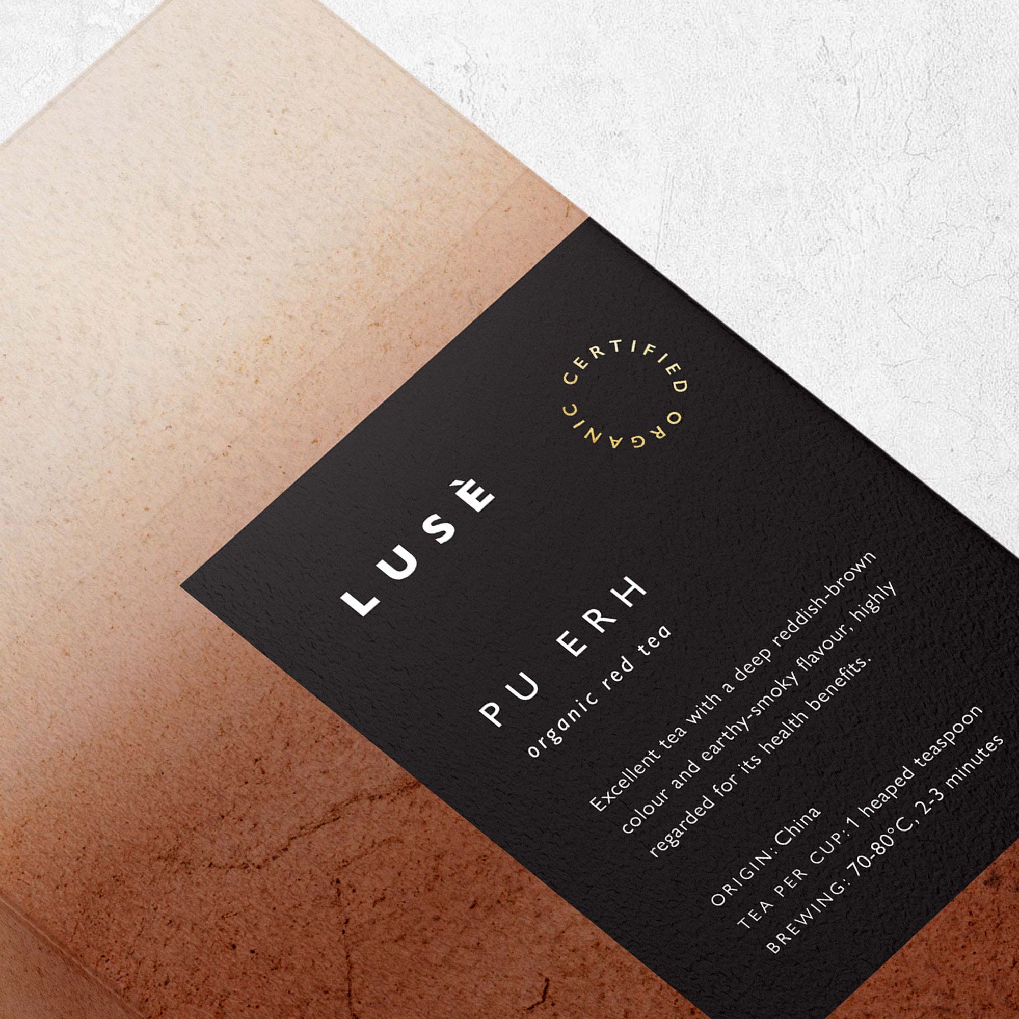 Karolina Król Studio close up of an elegant packaging design for organic tea boxes